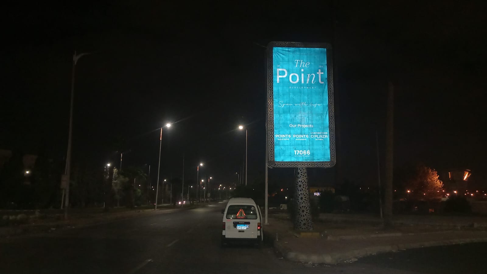 The Point Development illuminated unipole billboard at night