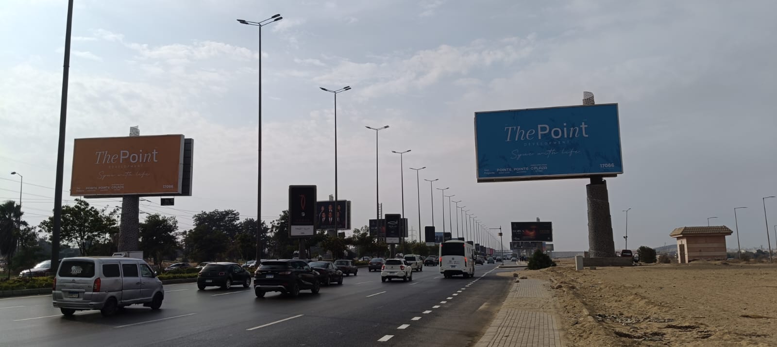 Two The Point Development billboards dominating a Cairo ring-road