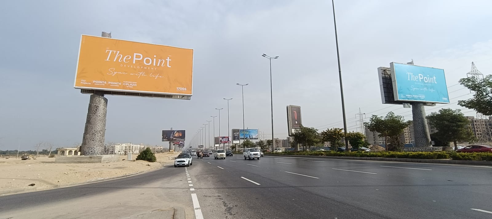 The Point Development billboards lining a New Cairo highway
